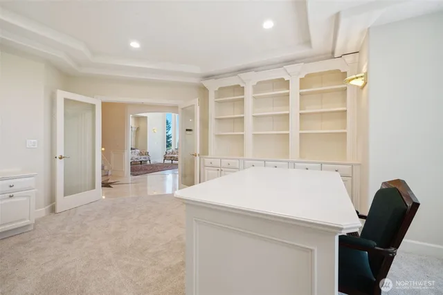 a view of workspace with wooden floor and windows