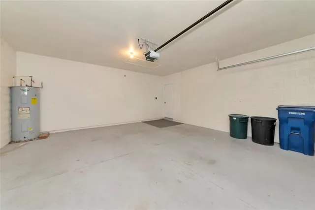 a view of a storage & utility room with two washing machine