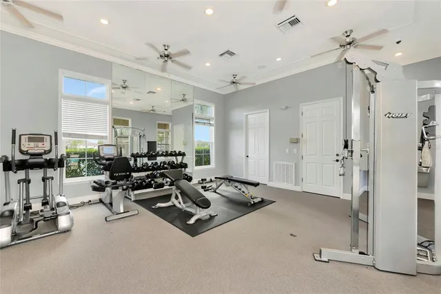 a living room with furniture a chandelier and a rug