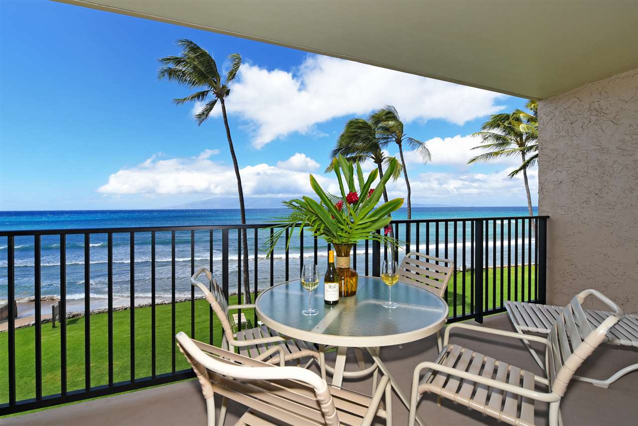a view of a chairs and table in patio