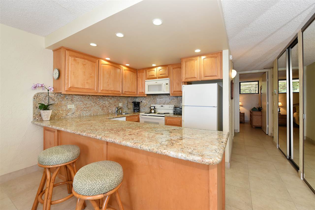 3543 Lower Honoapiilani Road, Unit L302 Lahaina, HI 96761 - Photo 13 of 28 a kitchen with refrigerator and a sink