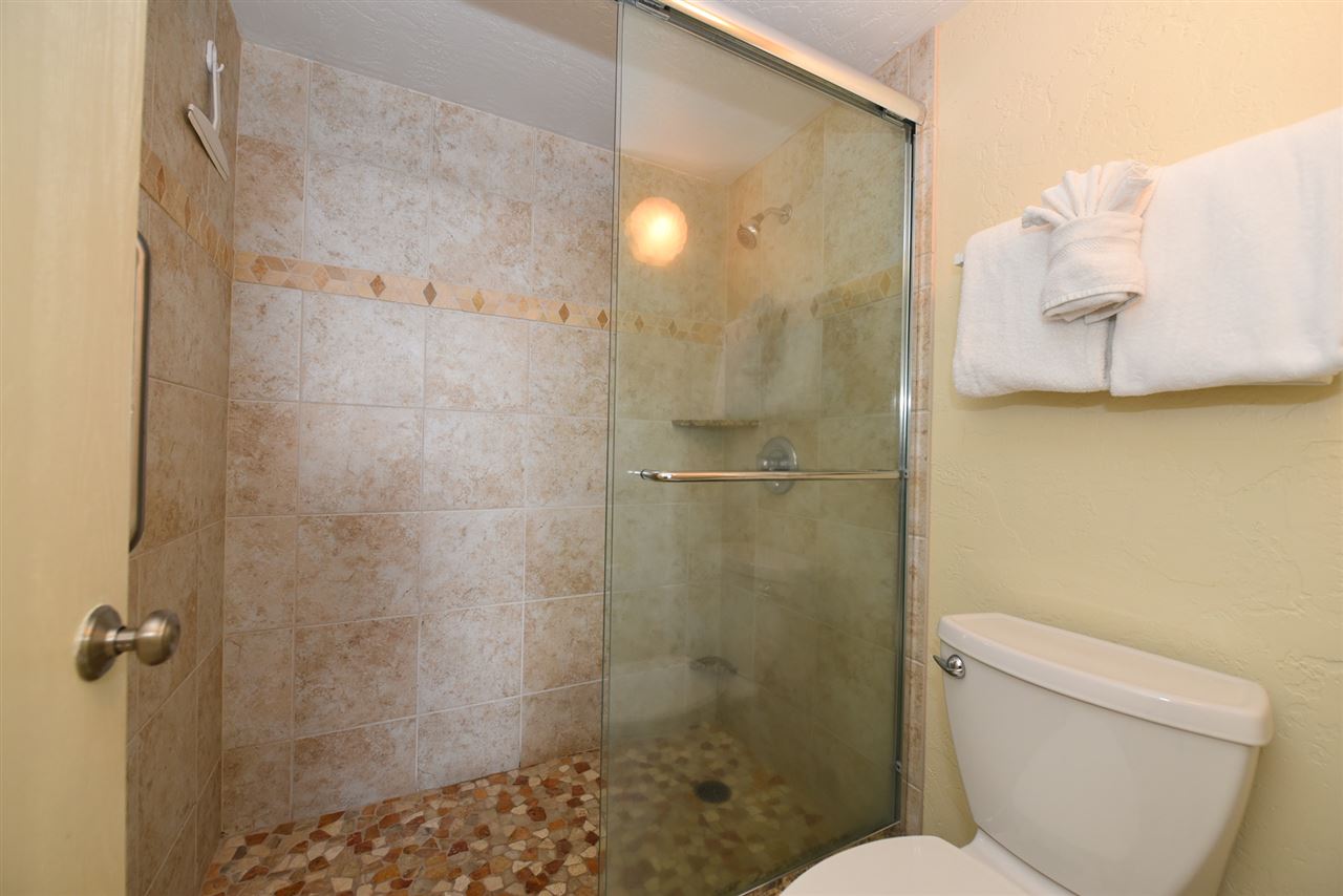 3543 Lower Honoapiilani Road, Unit L302 Lahaina, HI 96761 - Photo 19 of 28 a bathroom with a shower a toilet and a sink