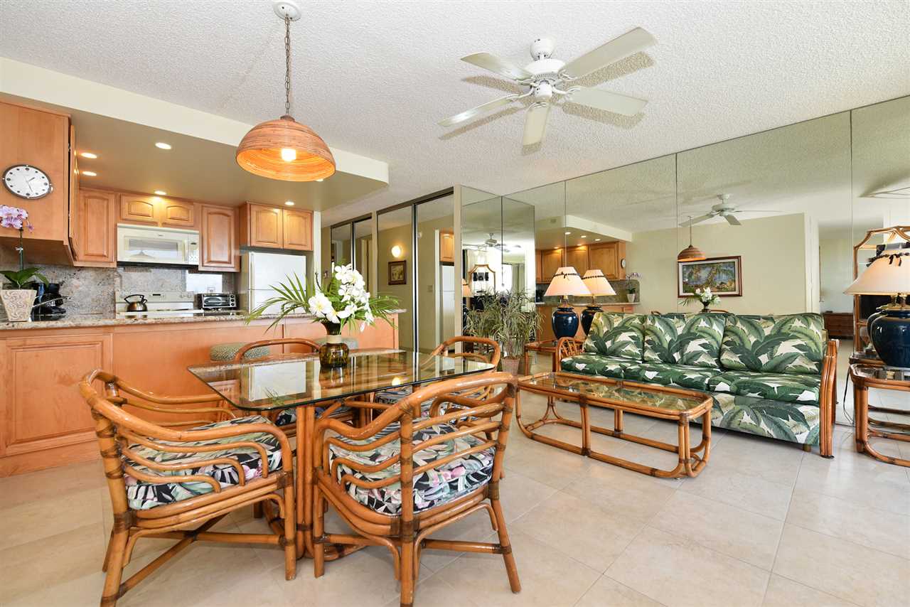 3543 Lower Honoapiilani Road, Unit L302 Lahaina, HI 96761 - Photo 4 of 28 a view of a dining room with furniture and a chandelier