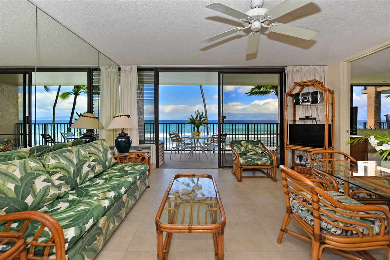 3543 Lower Honoapiilani Road, Unit L302 Lahaina, HI 96761 - Photo 6 of 28 a living room with furniture and a large window