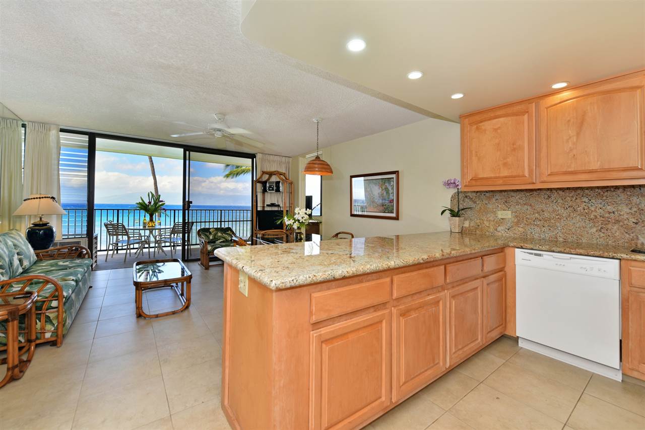 3543 Lower Honoapiilani Road, Unit L302 Lahaina, HI 96761 - Photo 9 of 28 a kitchen with a sink stove and cabinets
