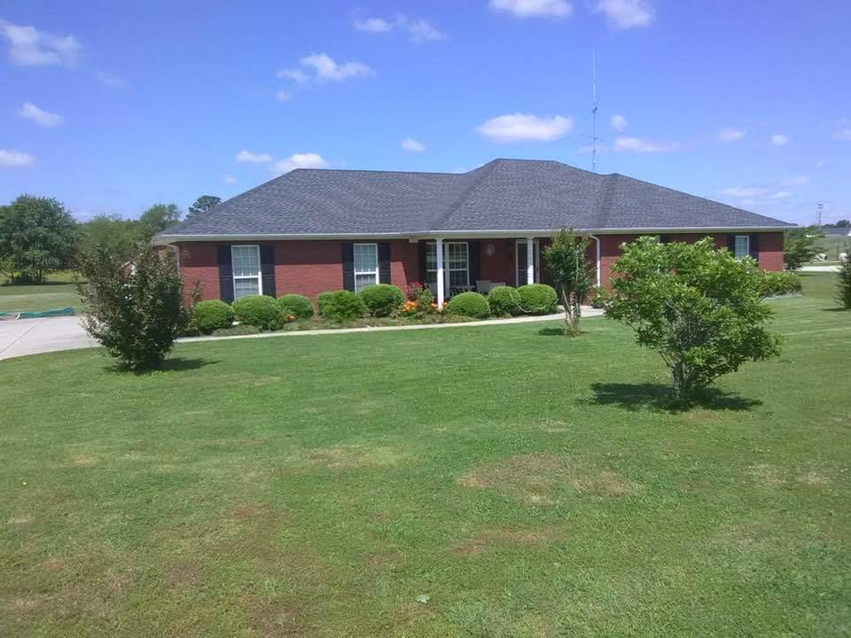 19 Power Station Road Taft, TN 38488 - Photo 1 of 16 a view of a house with a big yard potted plants and a yard