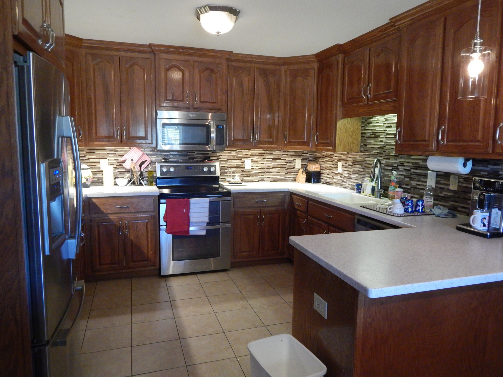 19 Power Station Road Taft, TN 38488 - Photo 4 of 16 a kitchen with stainless steel appliances a stove a sink and a refrigerator