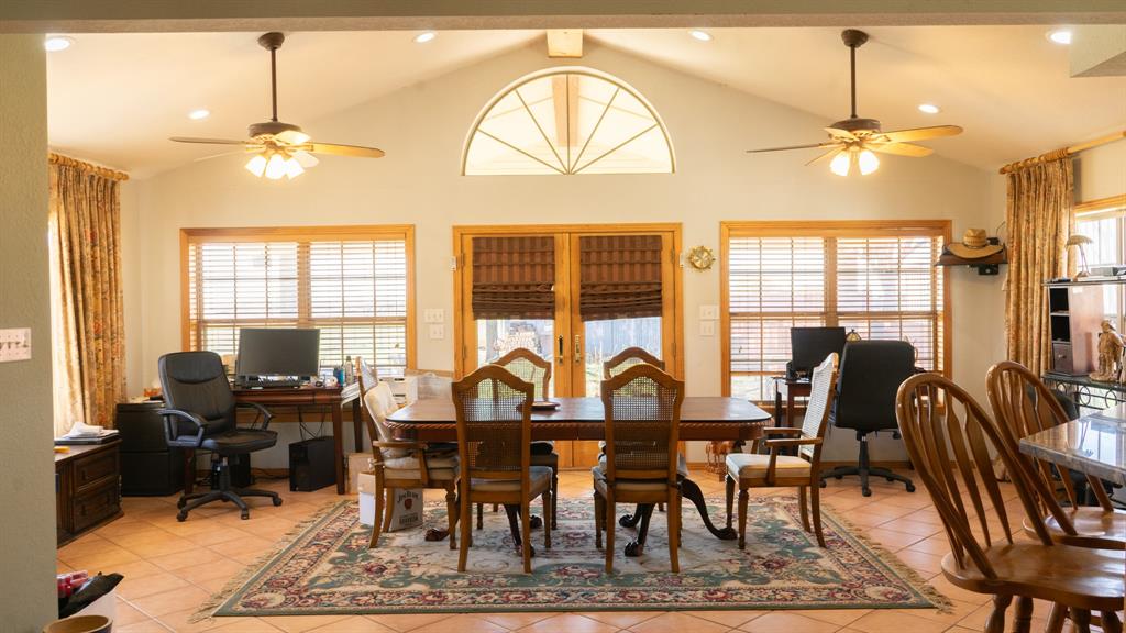140 Baize Road Abilene, TX 79602 - Photo 11 of 37 Dining space with a ceiling fan, recessed lighting, an office area, healthy amount of natural light, and a high ceiling