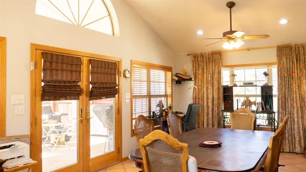 140 Baize Road Abilene, TX 79602 - Photo 14 of 37 Dining space featuring light tile patterned floors, a ceiling fan, lofted ceiling, recessed lighting, and french doors