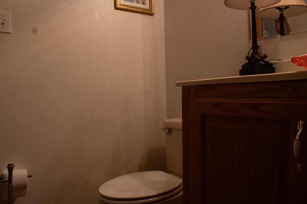 140 Baize Road Abilene, TX 79602 - Photo 22 of 37 Bathroom with vanity and a textured wall