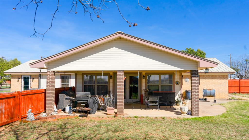140 Baize Road Abilene, TX 79602 - Photo 4 of 37 Rear view of property with a patio and brick siding