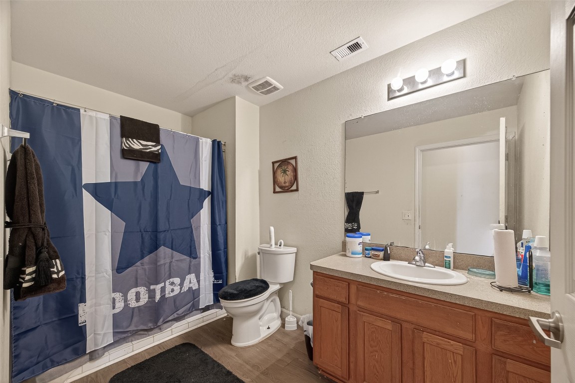 7100 Harlem Street Baytown, TX 77521 - Photo 20 of 30 a bathroom with a sink and a mirror