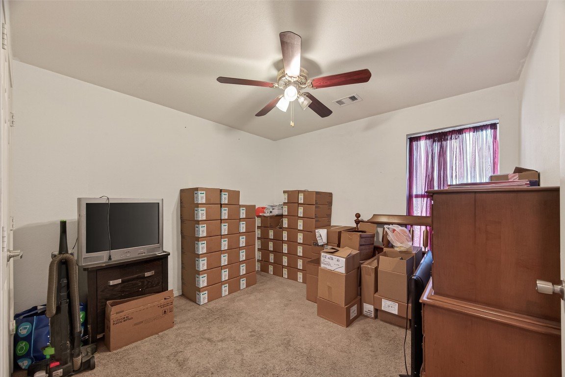 7100 Harlem Street Baytown, TX 77521 - Photo 21 of 30 a view of a livingroom with furniture and a flat screen tv