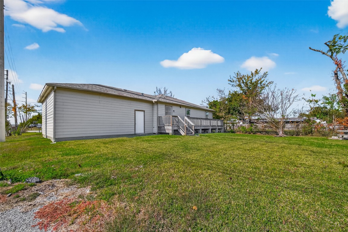 7100 Harlem Street Baytown, TX 77521 - Photo 28 of 30 a view of a backyard with table and chairs
