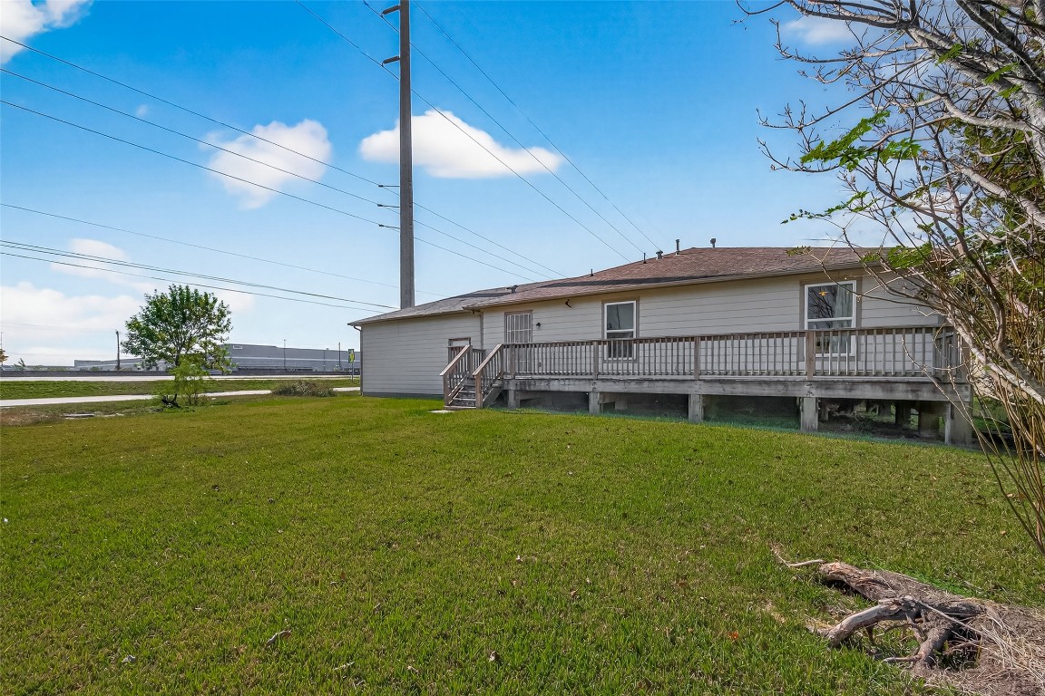 7100 Harlem Street Baytown, TX 77521 - Photo 30 of 30 a view of a house with a backyard