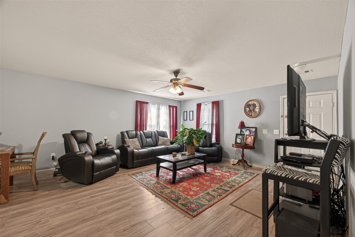 7100 Harlem Street Baytown, TX 77521 - Photo 8 of 30 a living room with furniture a rug and a window