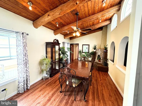 a view of a dining room with furniture window and wooden floor