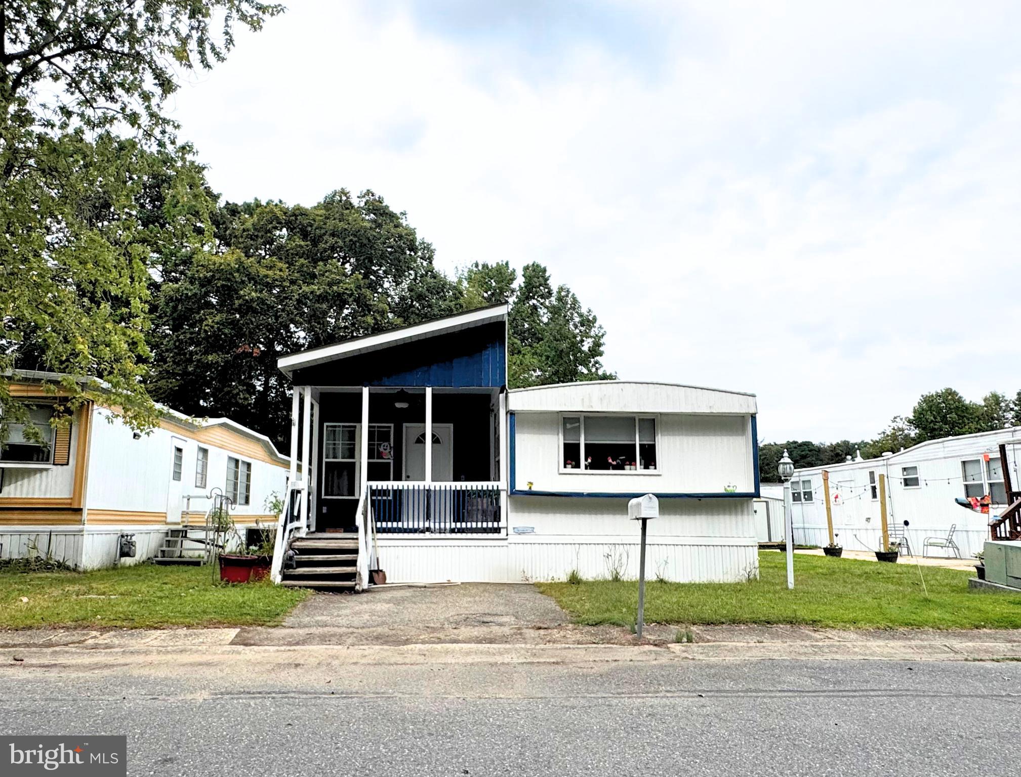 18 Alexander Avenue Jackson, NJ 08527 - Photo 2 of 22 a white house that has a tree in front of it