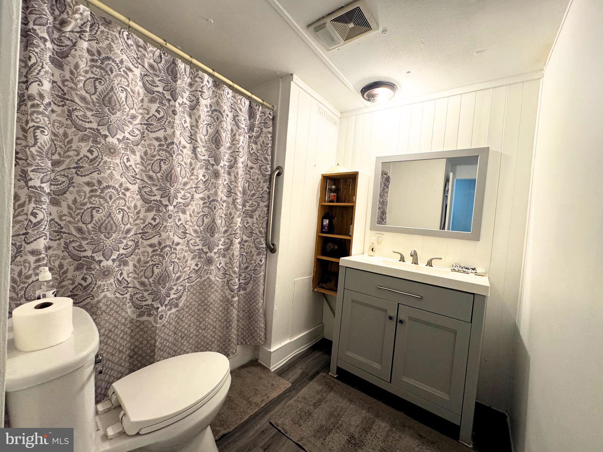 18 Alexander Avenue Jackson, NJ 08527 - Photo 8 of 22 a bathroom with a toilet sink and mirror