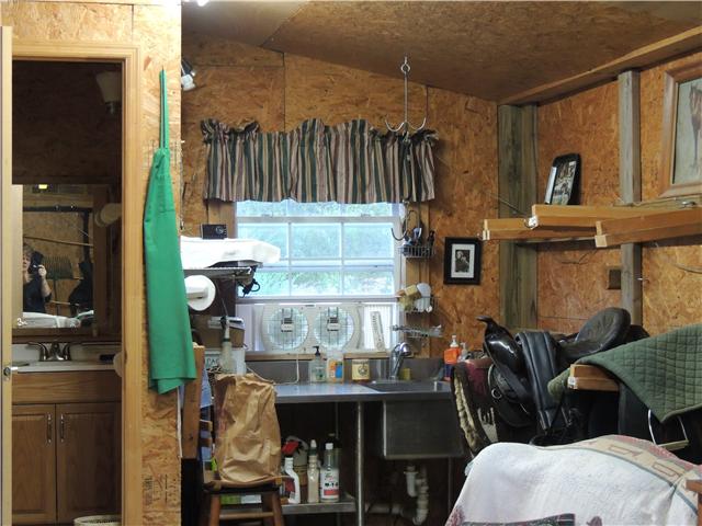 261 Hopkins Road Pulaski, TN 38478 - Photo 6 of 14 Tack room with 1/2 bath with cleaning area and workshop.