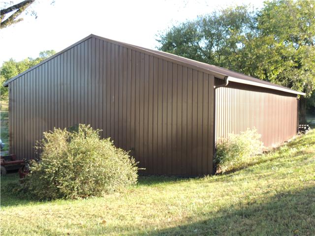 261 Hopkins Road Pulaski, TN 38478 - Photo 10 of 14 Spacious equipment shed to store farm implements out of inclement weather. Ground level hay storage with three more gated stalls, water and lights.