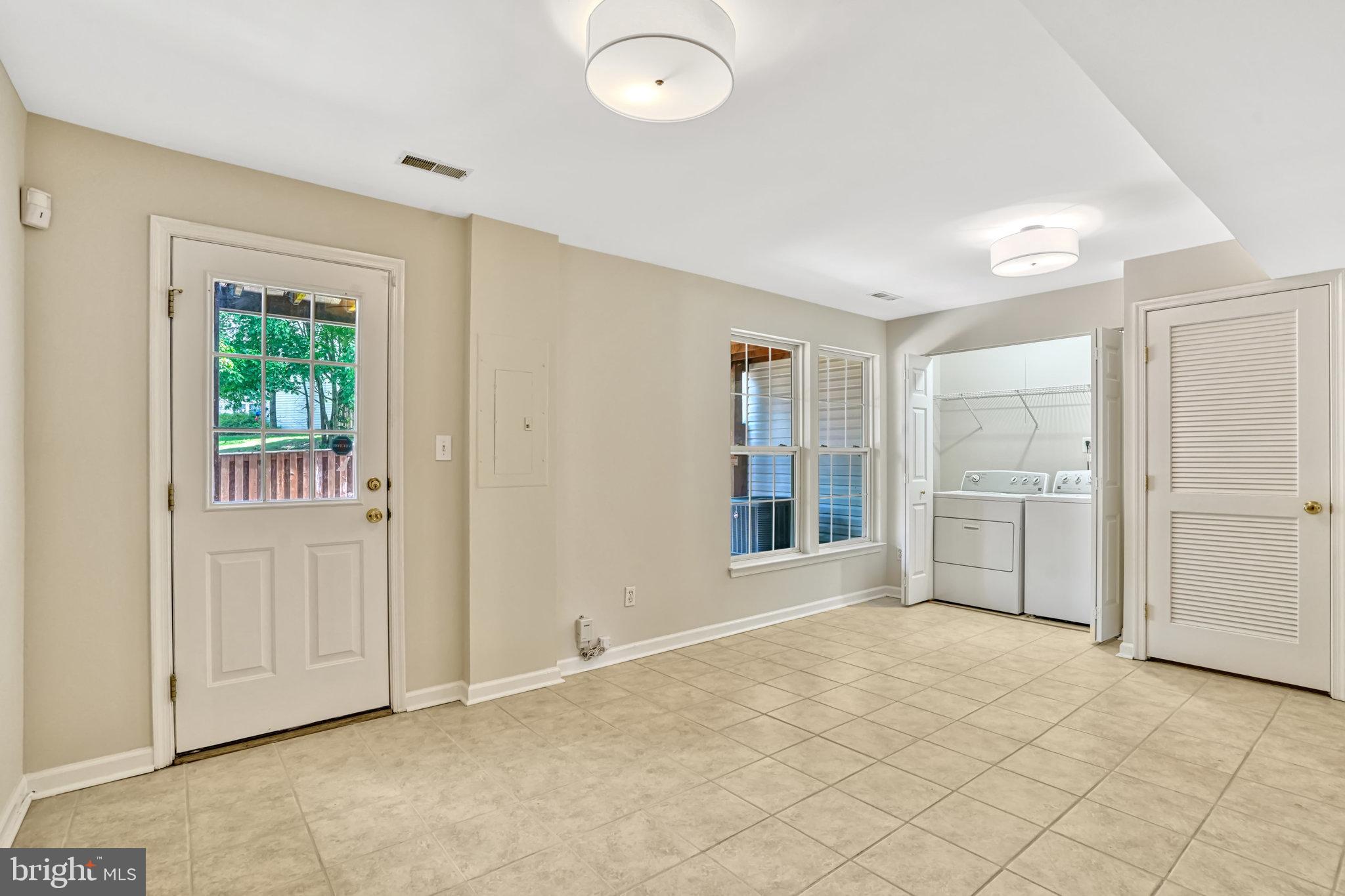 10159 Elgin Way Bristow, VA 20136 - Photo 11 of 50 a view of an empty room with window and cabinet