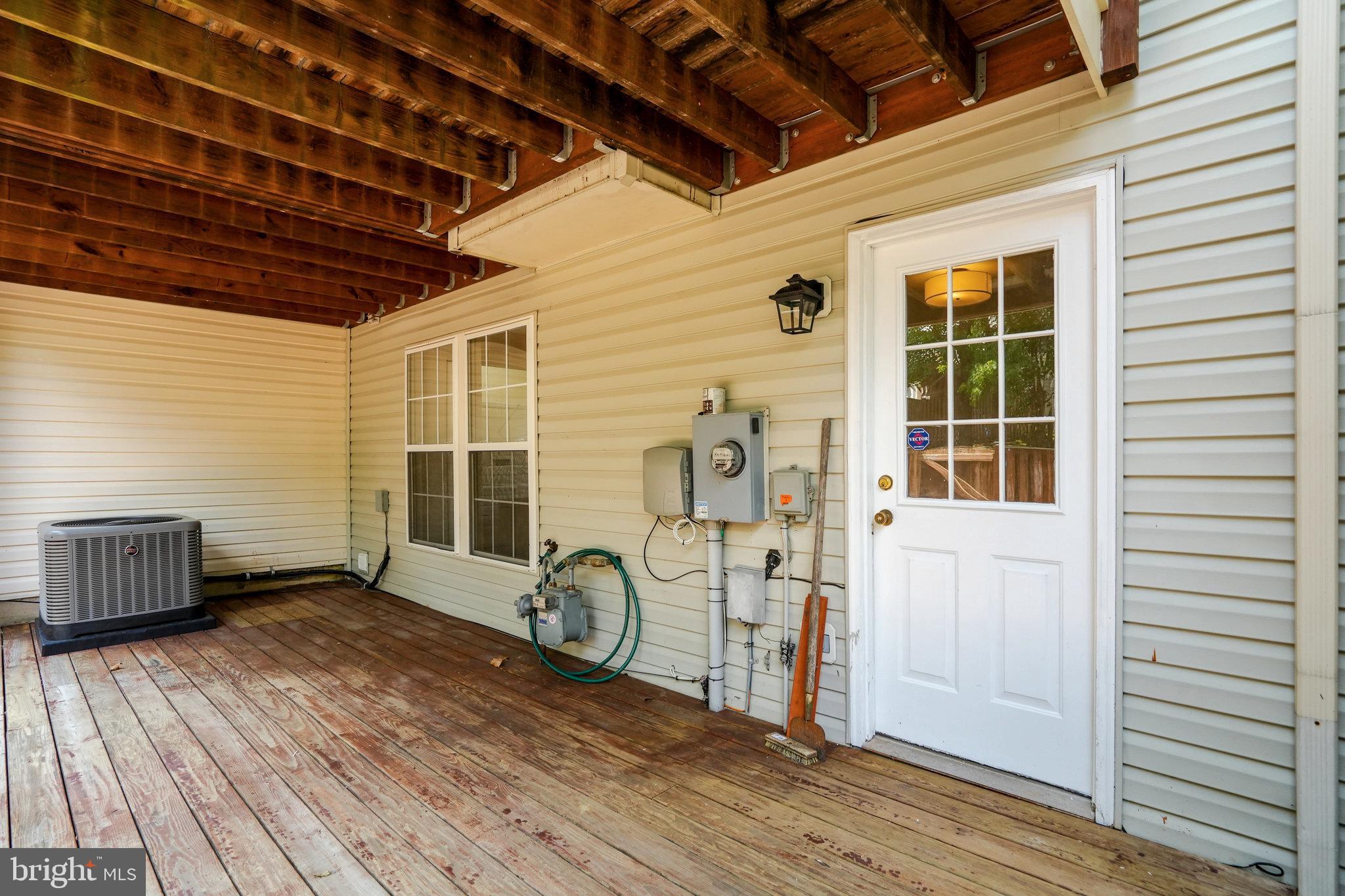 10159 Elgin Way Bristow, VA 20136 - Photo 14 of 50 a view of a car garage with wooden floor