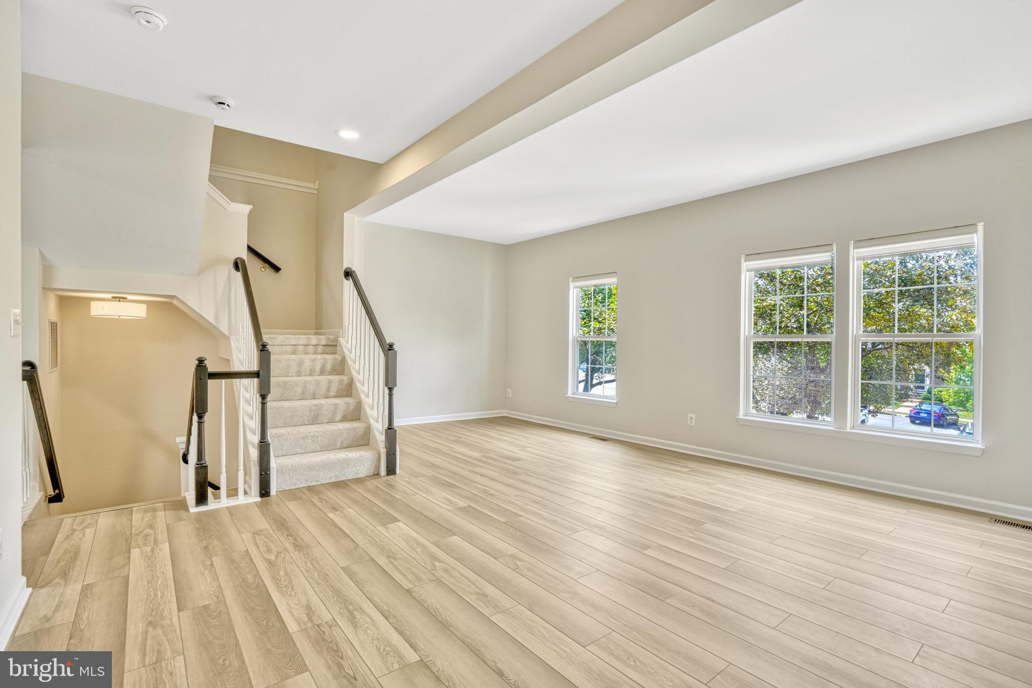 10159 Elgin Way Bristow, VA 20136 - Photo 20 of 50 a view of empty room with wooden floor and fan