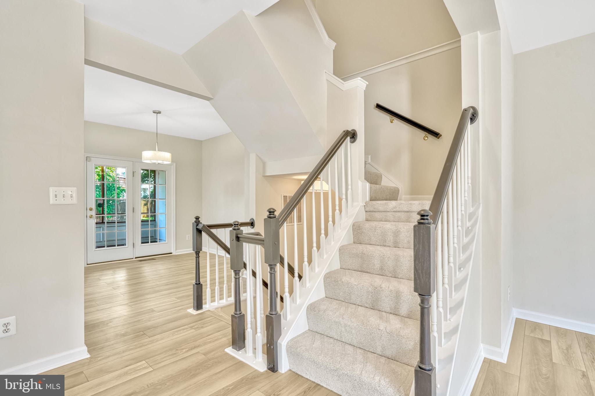 10159 Elgin Way Bristow, VA 20136 - Photo 23 of 50 a view of entryway and hall with wooden floor