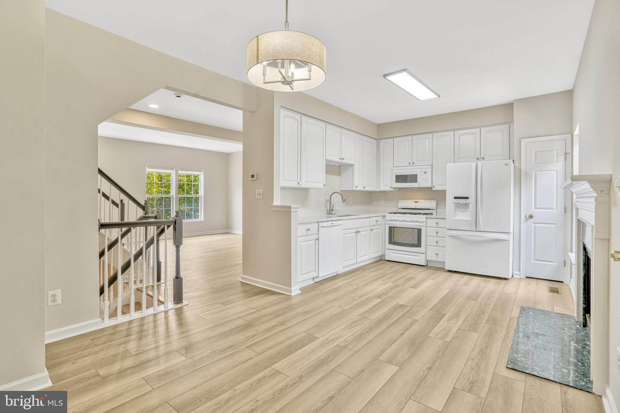 10159 Elgin Way Bristow, VA 20136 - Photo 25 of 50 a view of kitchen with wooden floor and window
