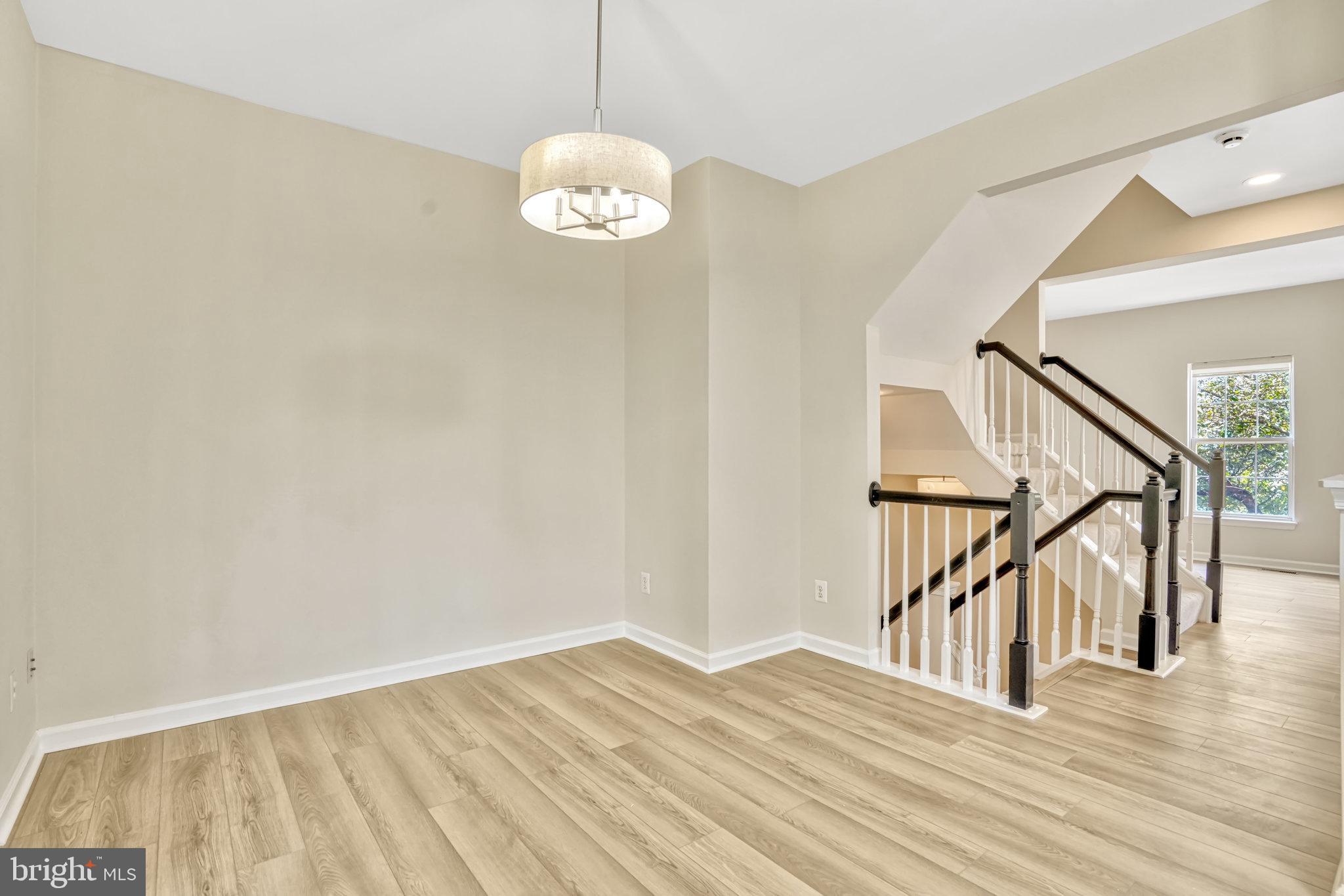 10159 Elgin Way Bristow, VA 20136 - Photo 26 of 50 a view of a livingroom with wooden floor