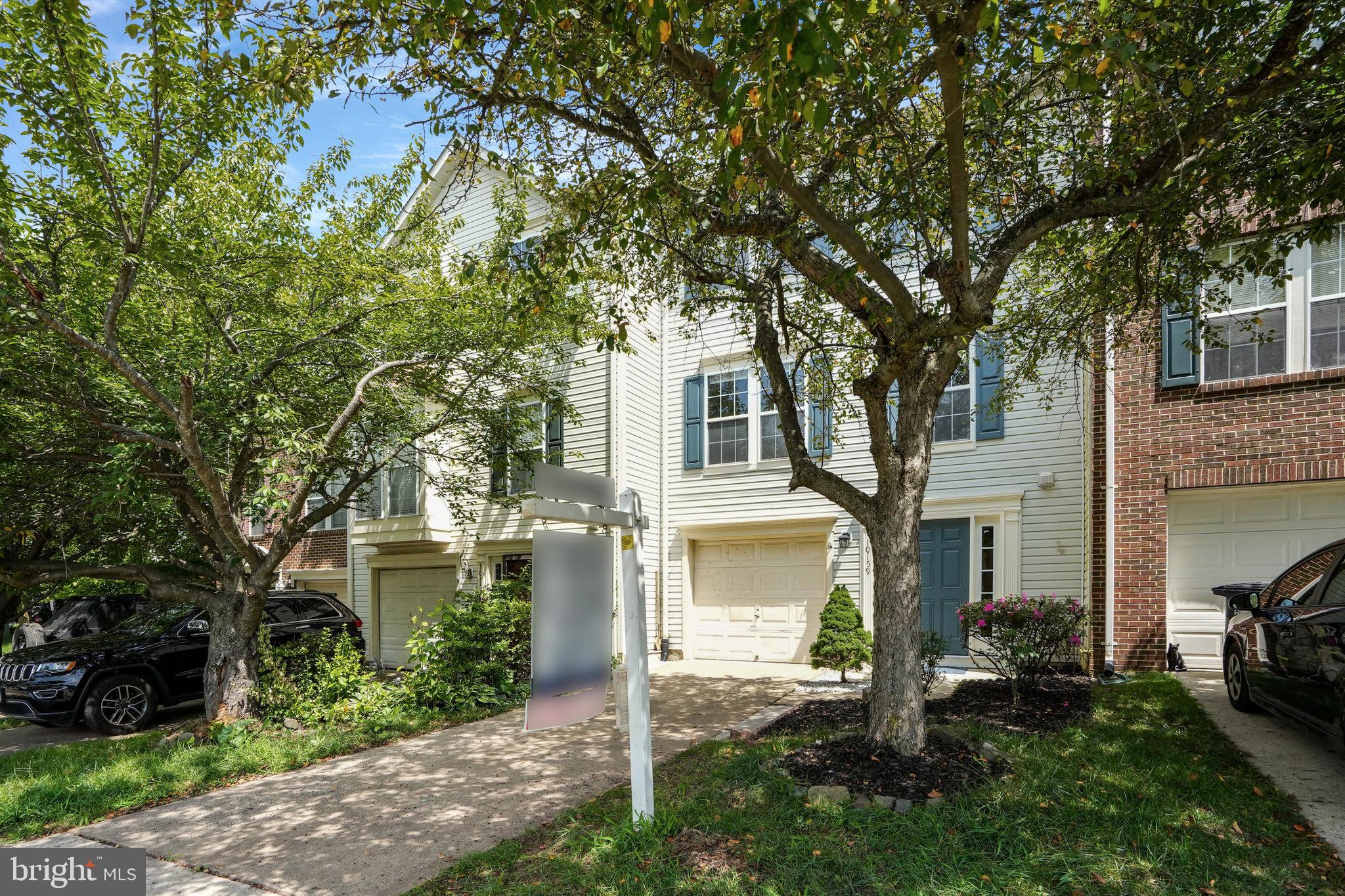 10159 Elgin Way Bristow, VA 20136 - Photo 3 of 50 a front view of a house with a yard