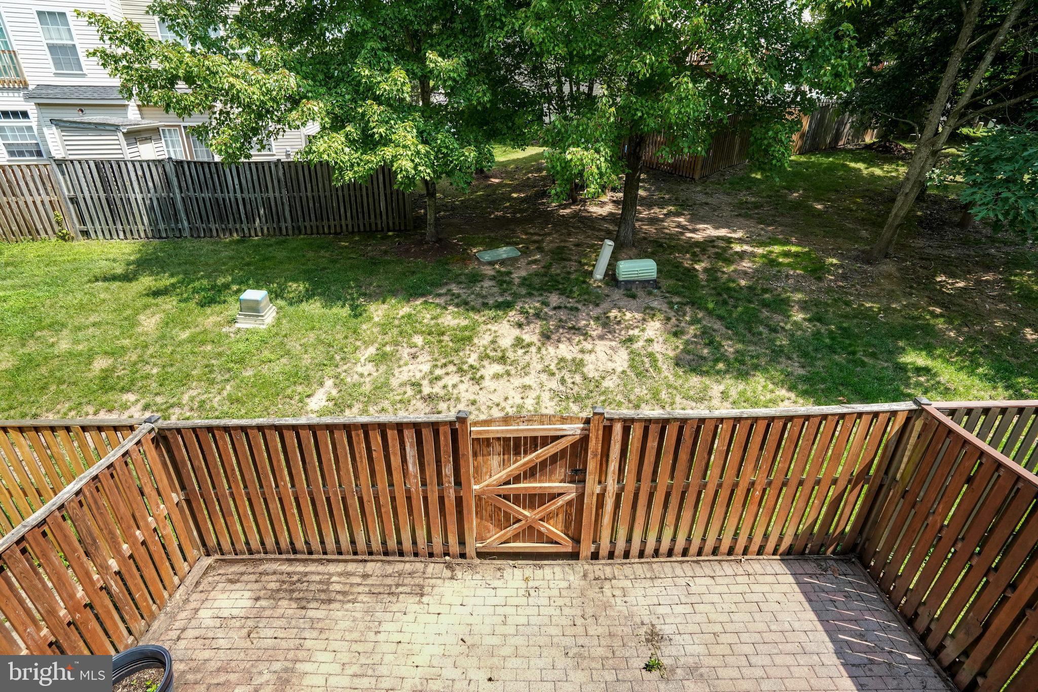 10159 Elgin Way Bristow, VA 20136 - Photo 44 of 50 a view of outdoor space with deck and a garden