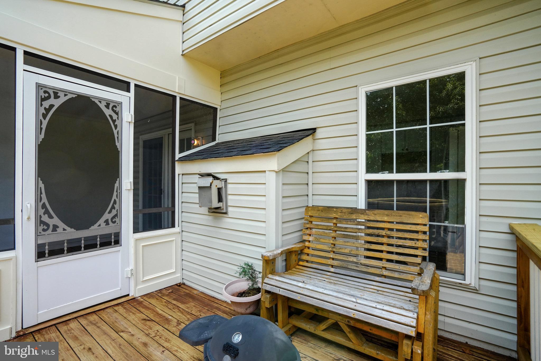 10159 Elgin Way Bristow, VA 20136 - Photo 47 of 50 a view of a balcony with furniture and wooden floor