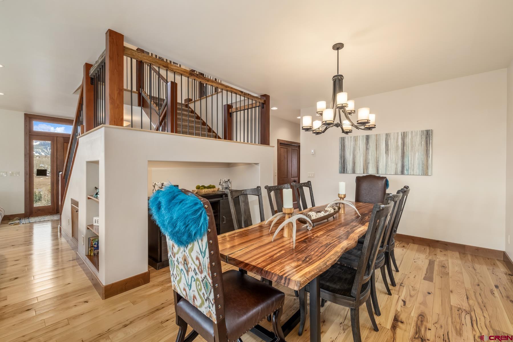 32 Cinnamon Mountain Road Crested Butte, CO 81225 - Photo 11 of 44 a view of a dining room with furniture and wooden floor
