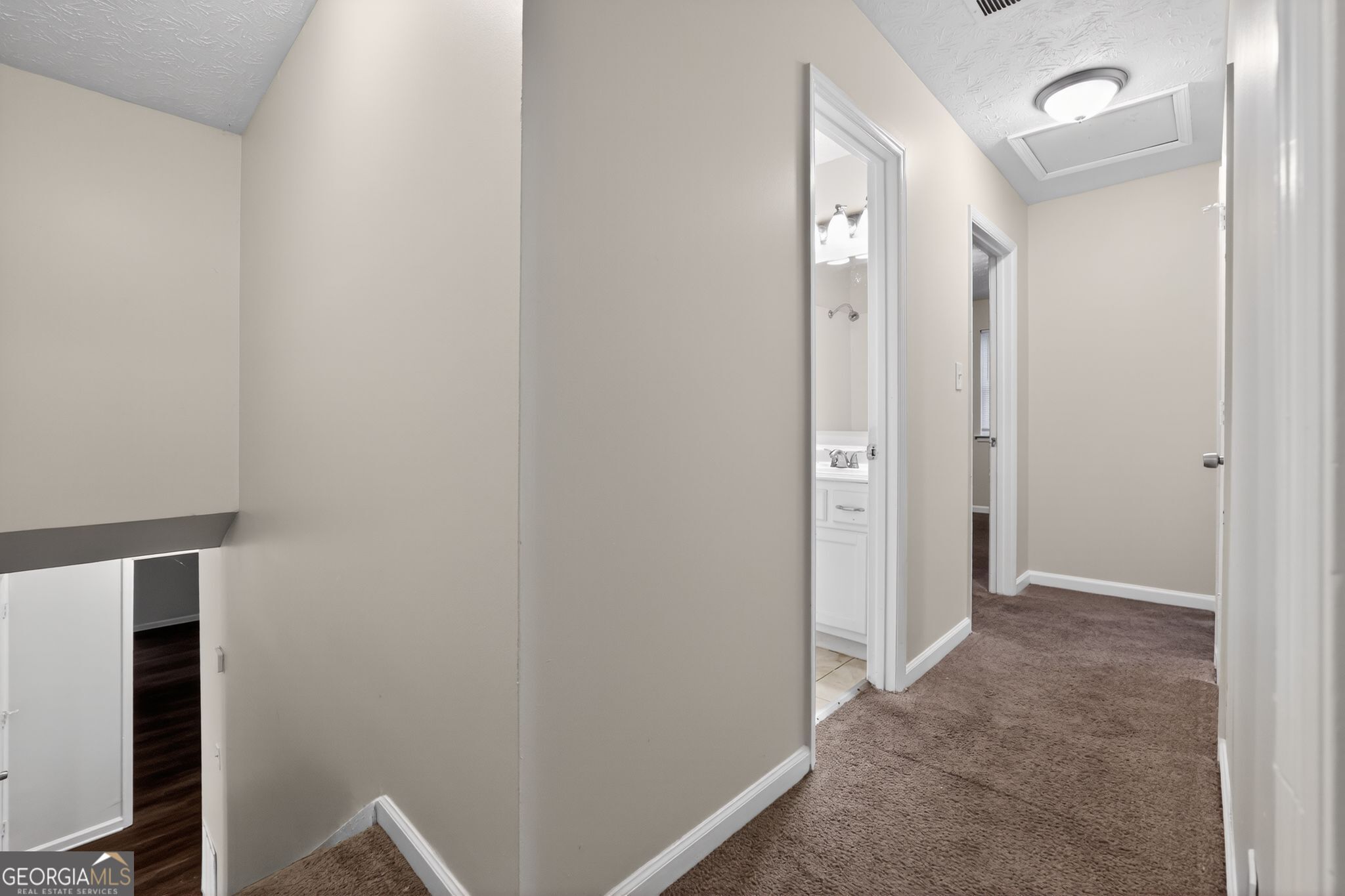 4586 High Gate Lane Lithonia, GA 30038 - Photo 16 of 33 a view of a hallway with closet and wooden floor