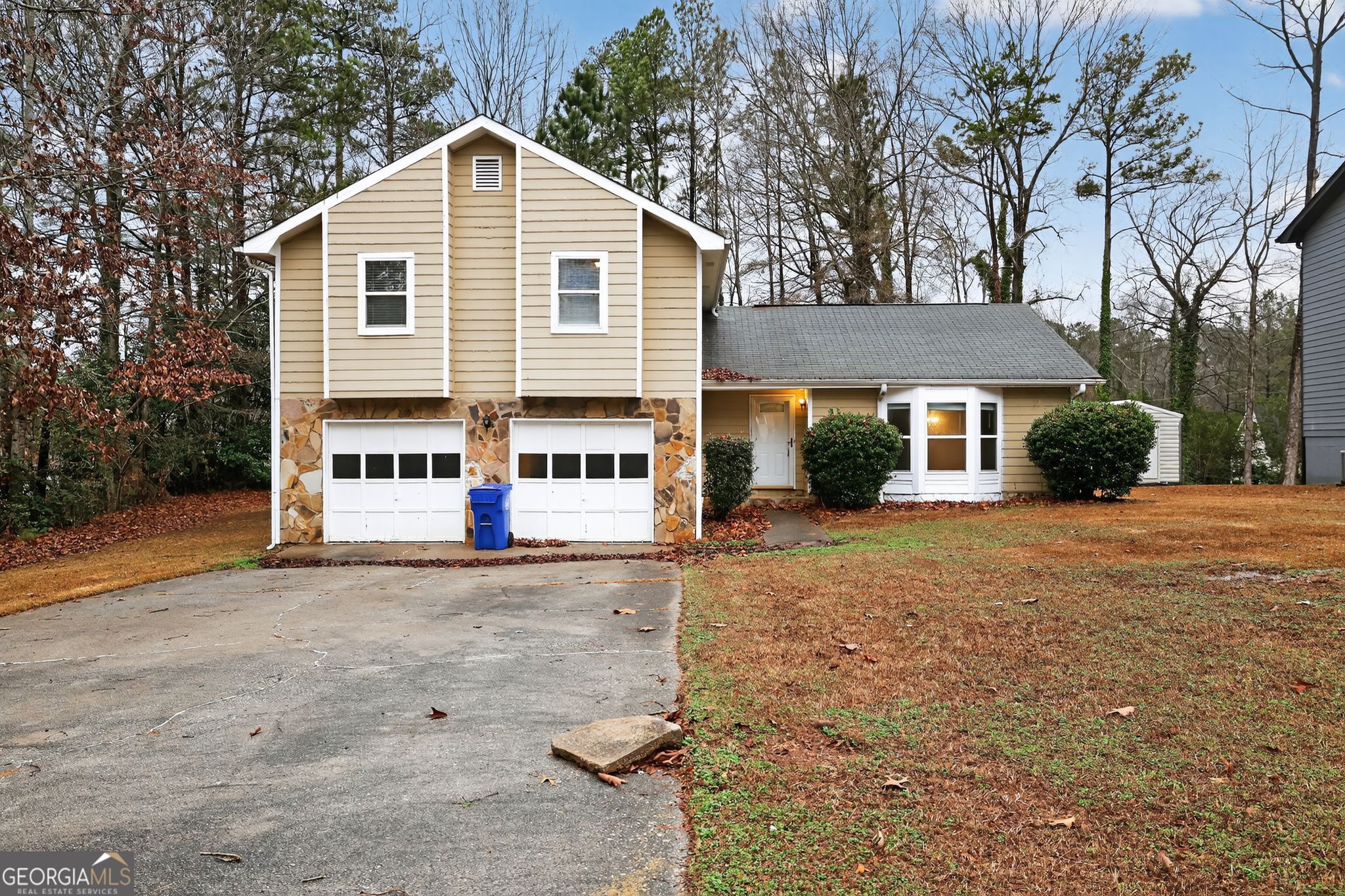 4586 High Gate Lane Lithonia, GA 30038 - Photo 2 of 33 a view of a white house with a yard and large tree