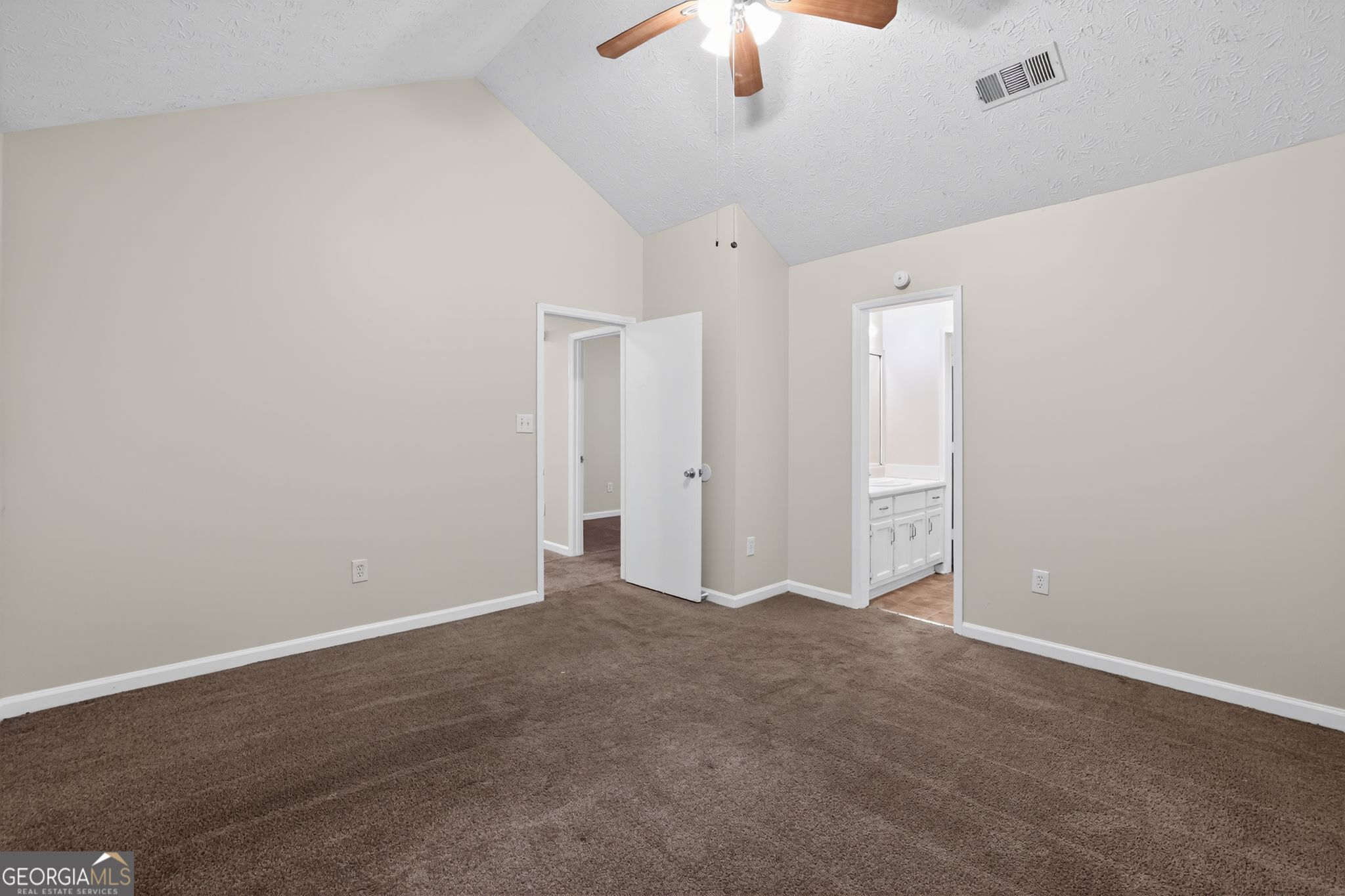 4586 High Gate Lane Lithonia, GA 30038 - Photo 24 of 33 a view of an empty room with a chandelier fan