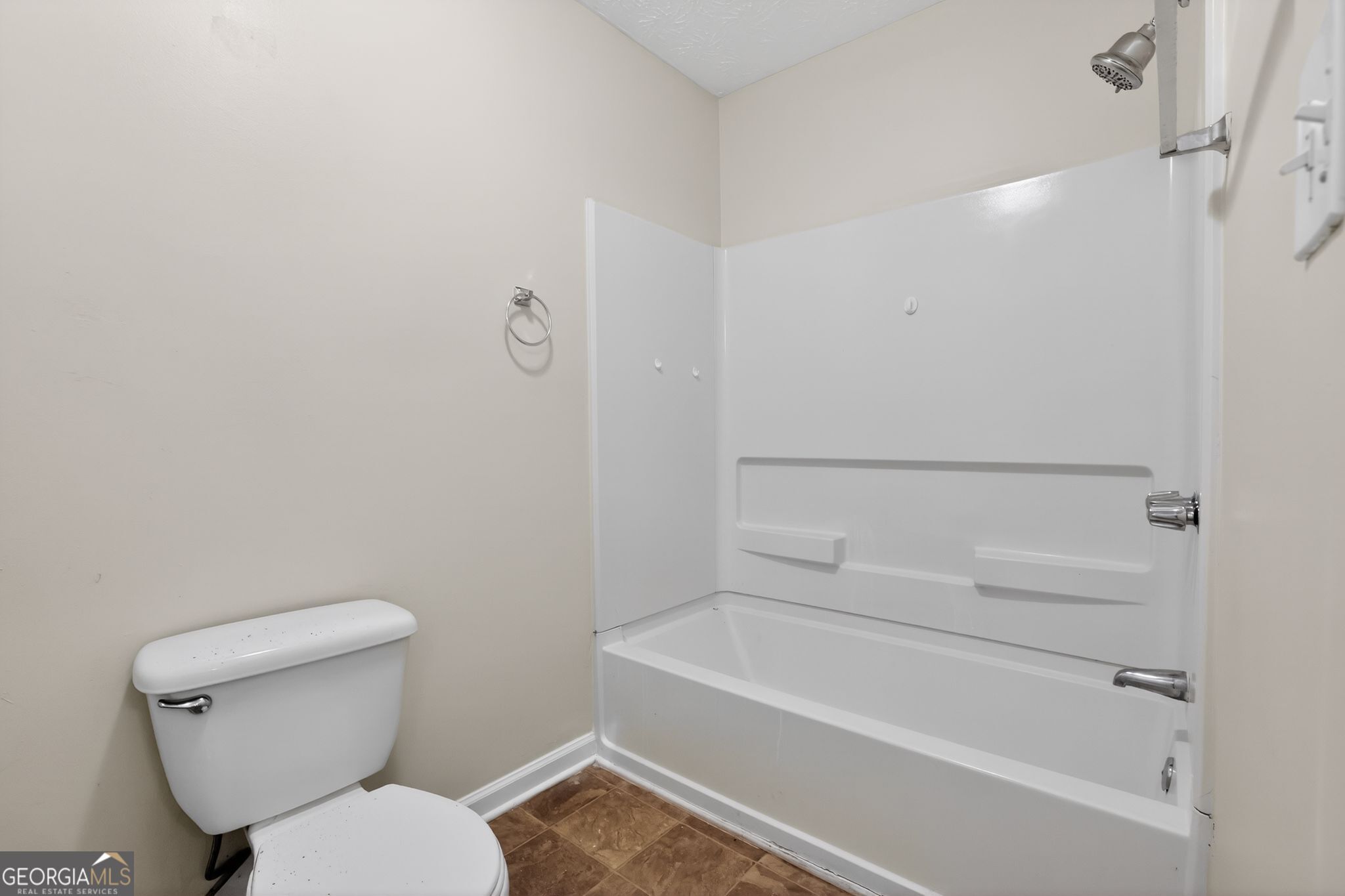 4586 High Gate Lane Lithonia, GA 30038 - Photo 25 of 33 a bathroom with a toilet and a bathtub