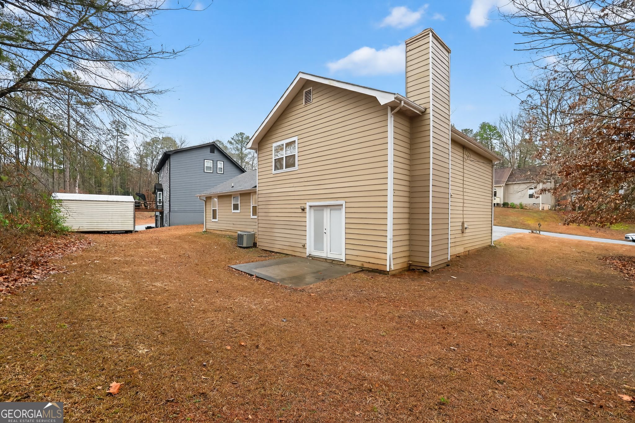 4586 High Gate Lane Lithonia, GA 30038 - Photo 30 of 33 a view of a house with a yard and garage