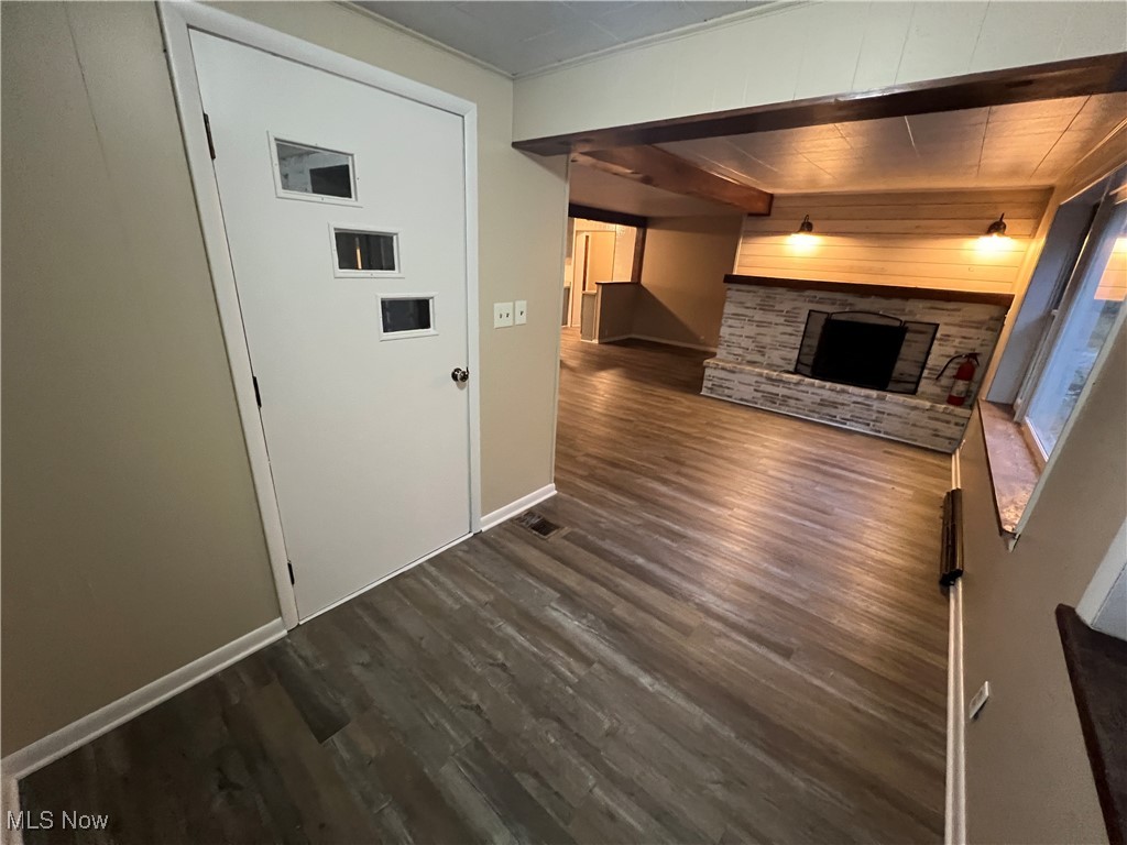 280 Holly Road Northwest Dellroy, OH 44620 - Photo 3 of 26 Corridor with dark hardwood / wood-style flooring