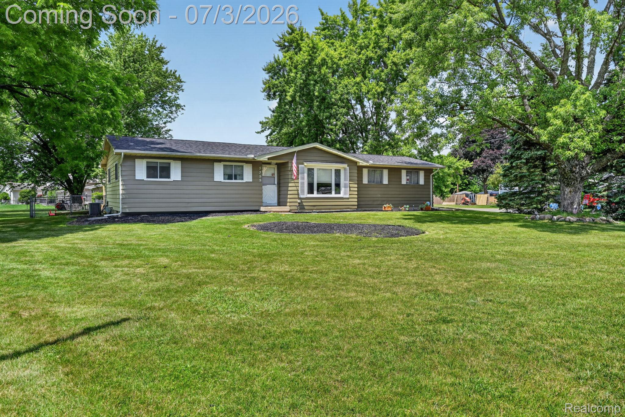 5355 North Seymour Road Flushing, MI 48433 - Photo 3 of 41 Ranch-style residence featuring a prominent bay window, horizontal siding, and white window shutters