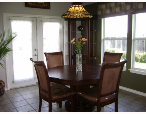 5126 Spring Brook Drive Corpus Christi, TX 78413 - Photo 3 of 10 a view of a dining room with furniture window and outside view