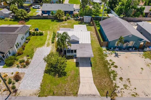 an aerial view of a house with outdoor space