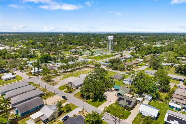 an aerial view of residential houses with outdoor space