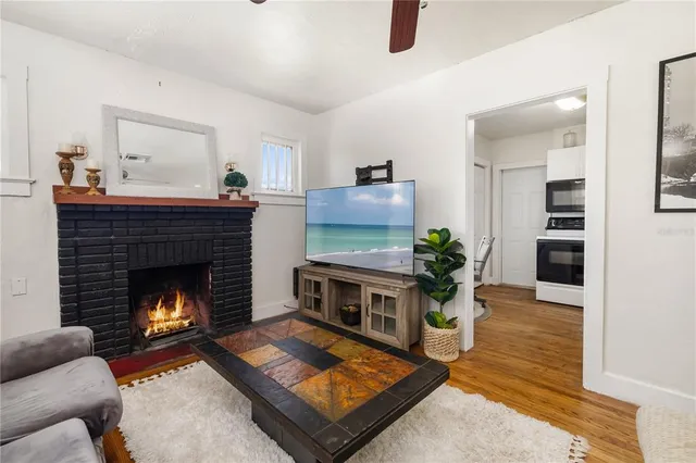 a living room with furniture and a fireplace
