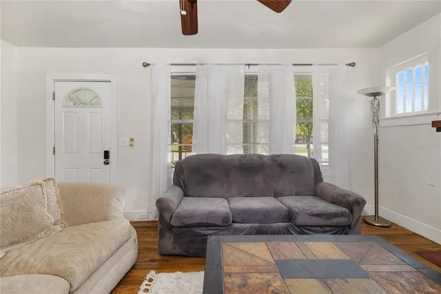 a living room with furniture and a window