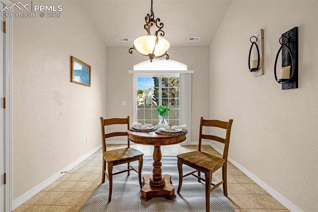 6658 Bethesda Point, Unit A Colorado Springs, CO 80918 - Photo 11 of 44 a dining room with furniture and window