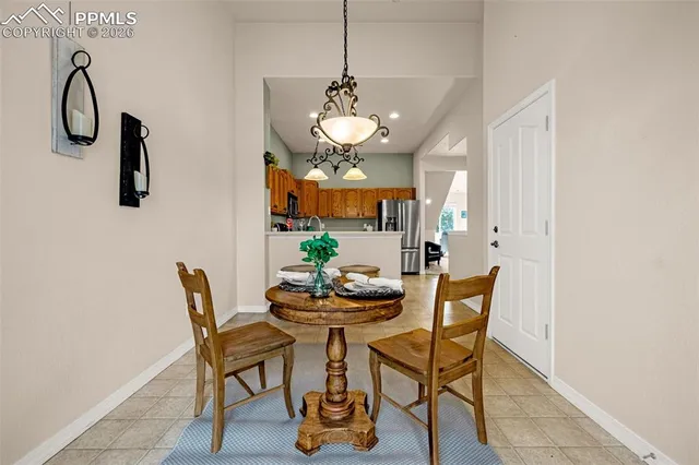 a dining room with furniture and window