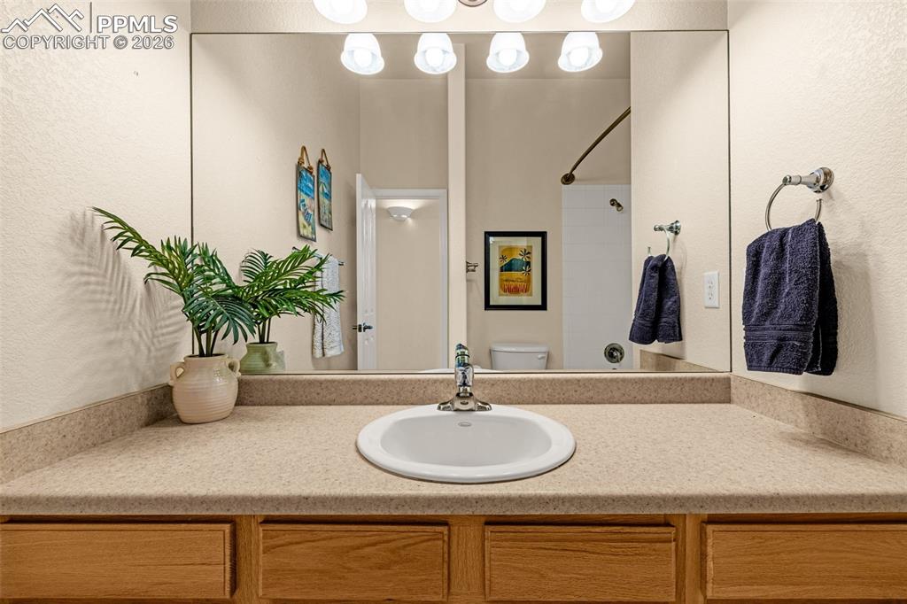 6658 Bethesda Point, Unit A Colorado Springs, CO 80918 - Photo 28 of 44 a bathroom with a sink and a mirror